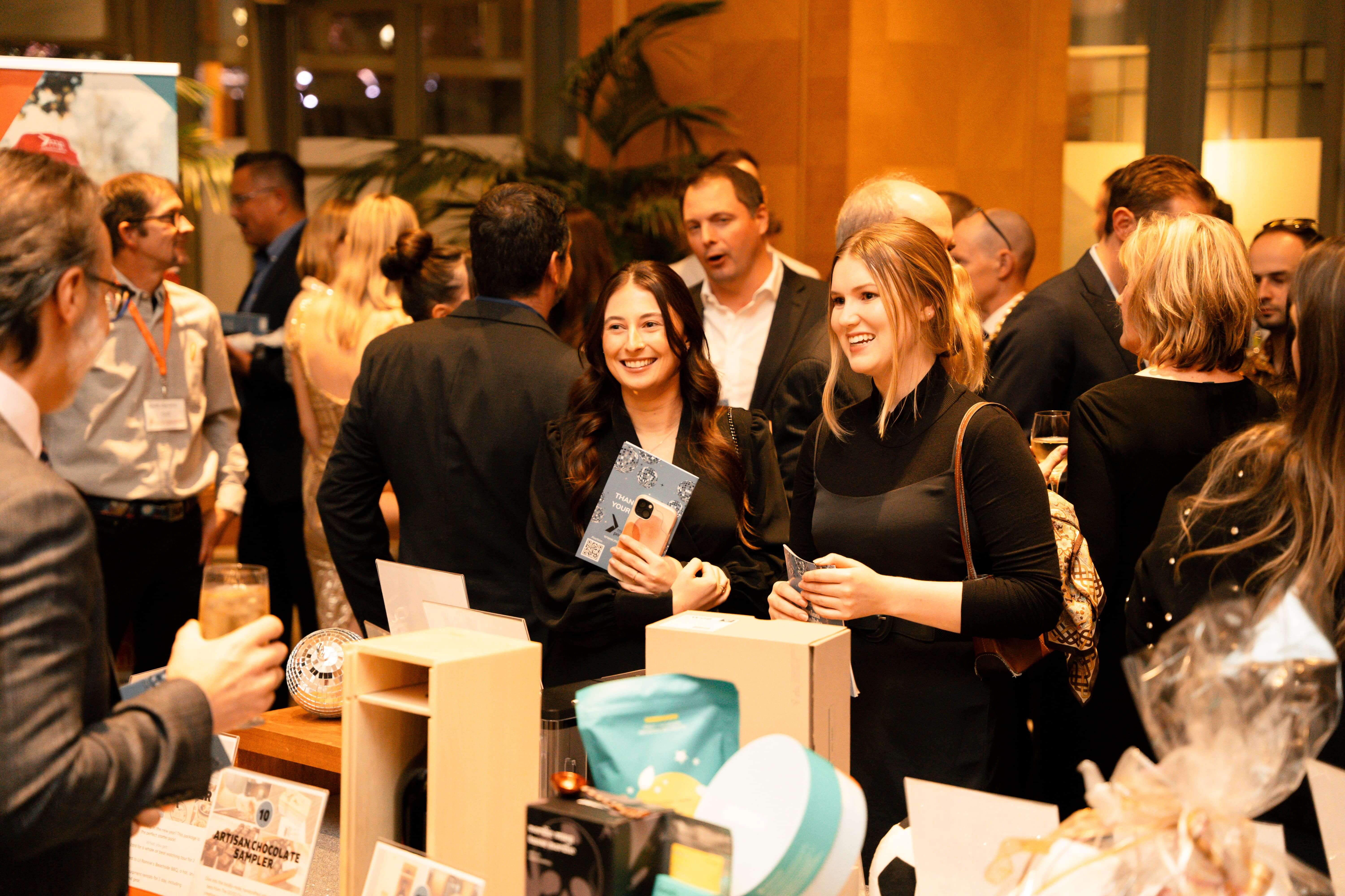 Guests networking and socializing at a Mission Possible community gathering or event